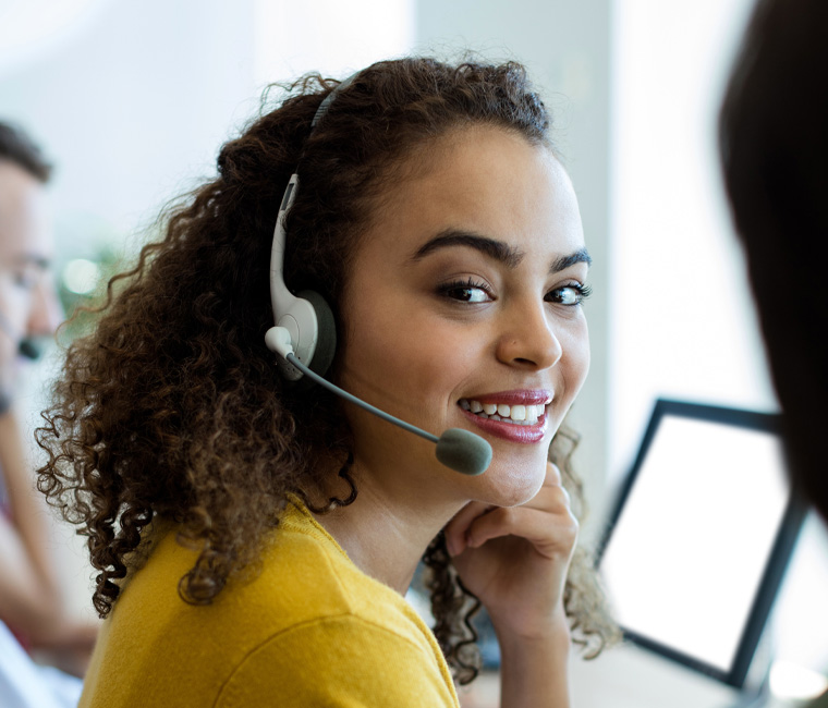 a woman talking to a patient using a headset