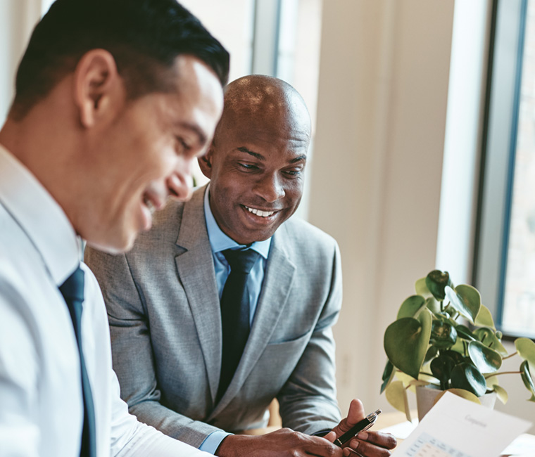 two members of a health sales team collaborating in the office